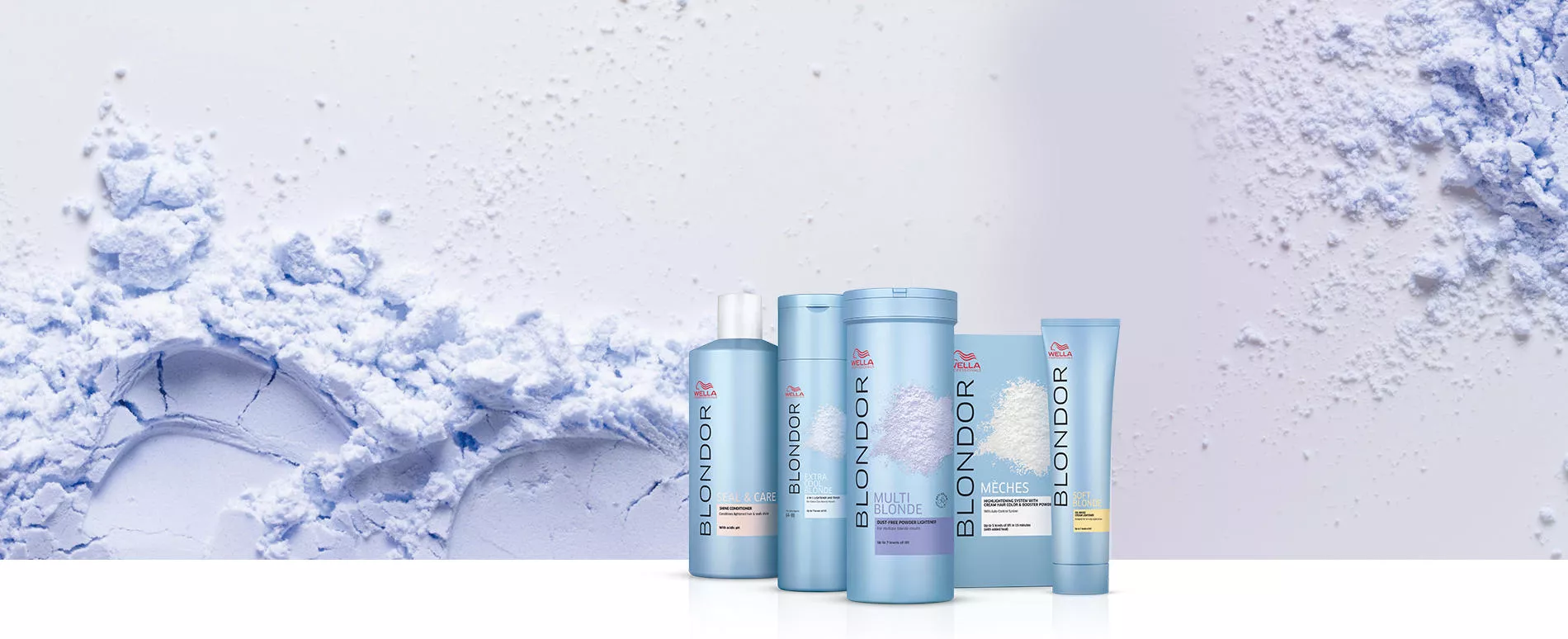Range of Wella Professionals Blondor products, with white powder sprinkled in the background